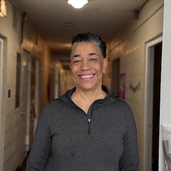 Instructor Stephanie Welch smiling in hallway